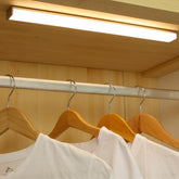 DESUNLUX closet light with motion sensor activated for hands-free wardrobe illumination.