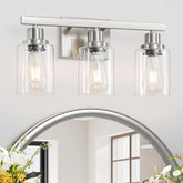 DIKAIDA 3-light nickel vanity fixture with clear glass shades for bathrooms.