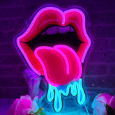 Dipomy Lips Tongue Neon Sign glows on wall for playful decor.