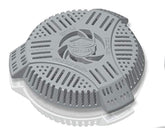 Drain Defender two-stage cover over a round drain blocks yard debris.