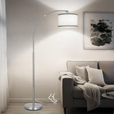 DWTB Silver Arc Floor Lamp with arching arm, ideal for cozy reading corners.