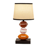 Ecliptix Kids Table Lamp with rugby-baseball design on a bedside table.