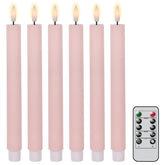Eldnacele real wax LED taper candle in pink finish providing warm ambience