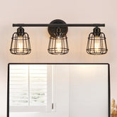 Elibbren 3-light vanity light in matte black cage over a bathroom mirror.