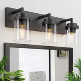 Espird 3-light matte black vanity light over mirror with clear glass shades