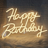EXORUN Happy Birthday Neon Sign glowing as a backdrop