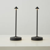 eypid 2-pack cordless lamps black on table for warm ambient lighting.