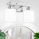FAISHILAN brushed-nickel 2-light bathroom light illuminating a vanity mirror with balanced glow