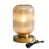Feasey glass table lamp with mid-century amber shade adds warm ambiance to any room.