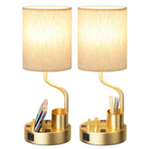 Fenmzee gold-base bedside lamp with two outlets and USB ports for convenient charging.