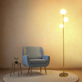 Fiqevs 3 globe floor lamp with gold base offers stable, stylish lighting for living rooms.