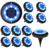 Flacchi Solar Ground Light blue pack 12 in the yard provides ambient illumination.