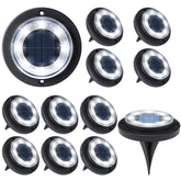 Flacchi solar ground light disk along a walkway showing cool white glow for safe paths