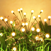 Flumy solar garden lights outdoor 4-pack with warm white firefly glow along pathways