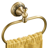 Flybath oval towel ring in antique brass with closeup carving for a timeless bathroom accent.