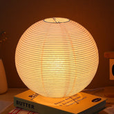 Gadpiparty desk lamp base view shows modern metal frame and paper shade for warm ambience.