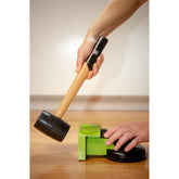 Gap Tap heavy-duty tool with suction cup demonstrating firm grip on the floor