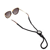 GATYZGEAR eyeglass lanyard with AirTag holder closeup showing tracking compatibility
