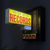 Generic Record Store Retro Wall Light, front view, vinyl glow for ambient room lighting.