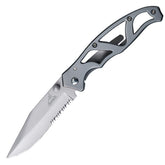 Gerber Paraframe clip-point blade close-up showing precise cuts in tight spaces.