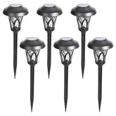 GIGALUMI 6-pack solar pathway lights illuminate outdoor paths with a warm white glow.