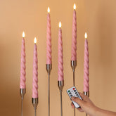 Girimax pink flameless taper candle close-up showing wax-coated realism for cozy ambience.