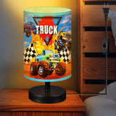 Glooglitter Monster Truck table lamp front view enhances kid's room ambiance.