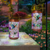 Go2garden hummingbird lantern pattern casts colorful shadows on patio