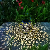 Go2garden teal blue solar outdoor lantern glowing softly on patio at dusk for ambiance.