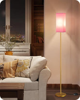 Goebleson floor lamp with pink lampshade and gold base adds elegant warm light to your space