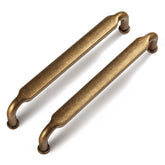 Goo-Ki 5in hole-center cabinet pull in antique brass for classic updates.