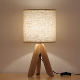 HAITRAL small bedside lamp with wooden tripod base for warm ambience.