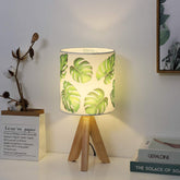 HAITRAL small table lamp with tripod wooden base for compact bedside lighting.