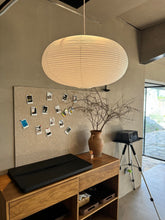Henjjras large white oblate shade viewed in full to highlight bold room statement
