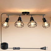 HiBay plug-in track light on black ceiling highlighting a dining area