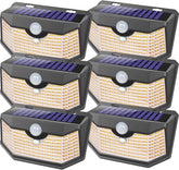 HMCITY 120 LED outdoor solar light with motion sensor lighting a walkway.
