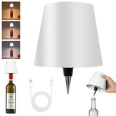 Hoide bottle lamp on table provides warm ambient light for gatherings.