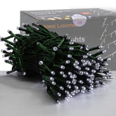 HOME LIGHTING 66ft white LED string lights brighten an outdoor hedge with warm glow