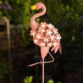 Homeimpro garden solar flamingo body casts warm glow for inviting outdoor ambiance.