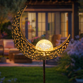 Homeimpro Moon Solar Lights illuminate the outdoor garden with a warm bronze glow.