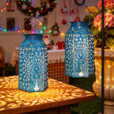 HOMEIMPRO Peacock Lantern blue gold adds ambient outdoor light to your garden.