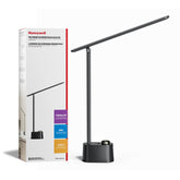 Honeywell H01 Pro Sunturalux foldable desk lamp on a compact, organized desk.