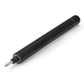iFixit precision electric screwdriver in use during electronics assembly for precise tightening.