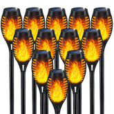 IkeeRuic solar flame torch on ground stake glowing to create outdoor ambiance