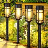 ILANCK 8-pack solar lights line a garden path with warm illumination.