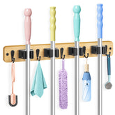 IMILLET bamboo mop holder on wall with four racks and five hooks for easy organization.