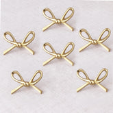 Indian Shelf brass gold bow knob closeup highlights premium finish for cabinets
