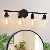 Indoi 4-light fixture with matte black finish and clear glass globes for a modern bathroom.