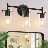 Indoi three-light matte black bathroom light over mirror for bright, even illumination.
