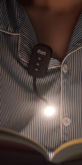 Inner Museum clip-on light in protective case for travel and easy storage.
